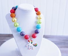 "Made with a rainbow of colors, this Unicorn necklace is sure to turn heads. This baby/toddler/child sized necklace is approximately 17\" long with a 2\" extender chain and jumbo lobster clasp for easy fastening. Since these necklaces are adjustable my one child size will fit from ages 0-12 and possibly beyond. Some small frame adults even wear my child size necklaces! However, they are also available in adult sizes. Matching bracelet is made with a stretch cord which makes them comfortable and Belle Necklace, Unicorn Pendant, Aqua Beads, Bubblegum Necklace, Unicorn Necklace, Christmas Necklace, Rainbow Necklace, Purple Turquoise, Chunky Beads