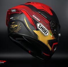 the helmet is designed to look like it has been painted red, yellow and black