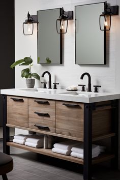 a bathroom with two sinks, mirrors and lights on the wall next to each other