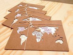 the world map is made out of brown paper and tied together with twine string