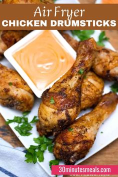 air fryer chicken drumsticks on a plate with dipping sauce