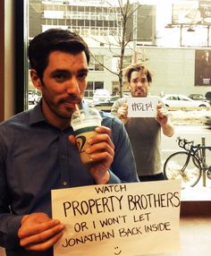 two men holding up signs in front of a window with the words watch property brothers or i won't let jonathan back inside