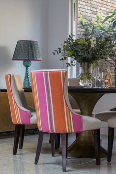 Wonderful fabric from Manuel Canovas instantly introduces colour and positivity into this dining space, beautifully complimenting the William Yeoward table lamp and our favourite Dakota table from Julian Chichester Julian Chichester, William Yeoward, Chichester, Dining Space, Table Lamp