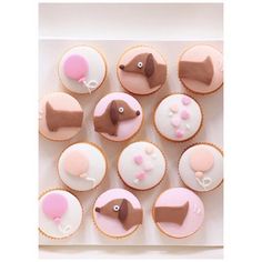 cupcakes with pink and brown icing in a white box on instagram