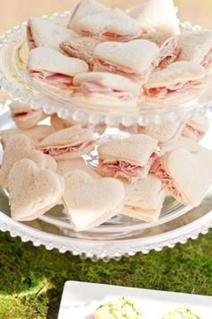 several sandwiches are stacked on top of each other in the shape of heart shaped cookies