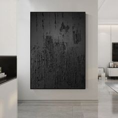 a black and white painting on the wall in a room