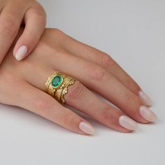 A luscious rose cut square emerald wrapped in 18k gold, surrounded by four diamond trios with 12 tiny diamonds, and set on a hammered, 1.5mm, 18k gold band. This ring would make a stunning engagement ring, or a special addition to any jewelry collection. Emerald measures approximately 8mm x 10mm. Matte finish. Oval Emerald Ring, December Gift, Hand Painted Gifts, Painted Jewelry, Hand Painted Jewelry, Stunning Engagement Ring, Ring With Diamond, Gold Ring Stack, Tiny Diamond