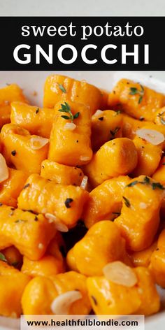 sweet potato gnocchi in a white bowl with garlic and parsley on top