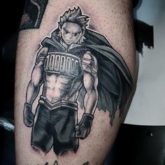 a man's leg with a tattoo on it that has an image of a hero