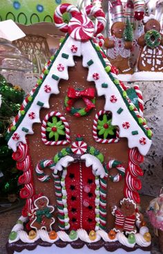 a large gingerbread house decorated with candy canes