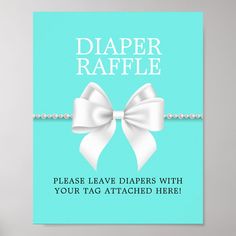 a blue card with a white bow and pearls on the side that says, diaper raffle please leave diapers with your tag attached here