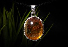 This pendant is not just a piece of jewelry, it is: The embodiment of beauty: It shines in the light like a sunbeam, making your look elegant and sophisticated. A symbol of unity: It connects you to nature, giving you a sense of peace and harmony. A gift of history: It carries the warmth and beauty of ancient times, making your look sophisticated and unique. Details: - Material: Baltic natural amber, - Metal: 925 sterling silver, rhodium plated  -Weight: 11.2 g -Total length of the pendant: 4.7 Elegant Amber Round Pendant Jewelry, Elegant Amber Jewelry With Large Pendant, Timeless Citrine Jewelry For Gift, Timeless Citrine Jewelry As Gift, Elegant Healing Jewelry With Round Pendant, Look Sophisticated, Amber Pendant, Natural Amber, Peace And Harmony