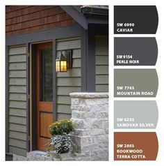 the exterior of a house with brown and gray sidings, wood door, and window