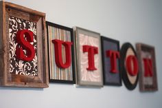 the word suton is spelled in red, white and black letters on a wall