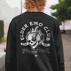 "*This shirt has a design on the FRONT & BACK* The Elder Emo Club T-shirt is the perfect Pop Punk Shirt for anyone who loves emo music and culture. With a striking skull design, this Emo Concert Shirt is the perfect way to show off your love for the genre. This Shirt for Elder Emo proudly displays the \"Emo Forever\" and \"It Was Never A Phase\" slogans, making it clear that your love for emo is here to stay. The Stay Sad Club Shirt is made with high-quality materials, ensuring both comfort and Emo Concert, Finding Emo, Elder Emo, Punk Shirt, Emo Music, Alt Girl, Concert Shirts, Emo Fashion, Club Shirts