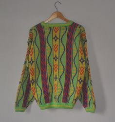 Up for sale stunning Vintage 1990s Bright Colour Knit sweatshirt Used sweatshirt, show sign of wear with 3 defects on back, Overall still in good vintage condition (Please refer picture) Size on label Medium with actual measurement taken when lying flat armpit 22.5 inches and 26 inches in total lenght (Approx) Please note that vintage sizing is not the same as modern sizing. Always go by the measurements we provide and compare them to an item that fits you well. Feel free to message me for measu 90s Graphic Print Sweater For Streetwear, 90s Long Sleeve Streetwear Sweater, Streetwear Crew Neck Knit Sweater, Retro Oversized Sweater For Streetwear, Oversized Retro Sweater For Streetwear, Green Y2k Style Winter Sweater, 90s Style Fall Sweater For Streetwear, 90s Fall Streetwear Sweater, Casual Knit Fabrication Sweatshirt For Streetwear