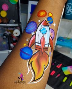 Painted space themed face painting Rocket Face Paint, Face Painting Simple Designs, Colourful Face Painting, Space Face Paint, Face Painting Designs Creative, Painting Easy, Space Girl