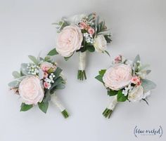 three bridal bouquets with pink and white flowers