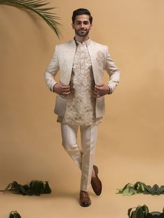 Custom Made Cream Color Jodhpuri suit for Men with organza Heavy Emroidered Kurta Inside  That Will Enrich Your Wardrobe & Make you Feel awesome When You Wear This suit. This blazer Comes With A Trouser.& a Kurta Inside.This is a must have in your wedding ceremony for groom or groomsmen.wear it in wedding or reception dress,sangeet or engagement this will enrich your look COST INCLUDES JODHPURI ,KURTA & TROUSERS Traditional Bollywood Nehru Jacket For Groom, Unstitched Gota Work Sherwani For Wedding, Bollywood Nehru Jacket With Dabka For Groom, Bollywood Style Nehru Jacket For Groom, Bollywood Style Nehru Jacket For Festive Groom, Bollywood Wedding Nehru Jacket With Dabka, Eid Naqshi Nehru Jacket For Groom, Bollywood Style Bandhgala For Groom With Naqshi Detailing, Bollywood Style Bandhgala For Groom With Naqshi