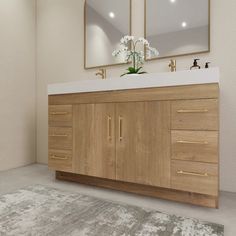 a bathroom vanity with two mirrors above it and a rug on the floor next to it