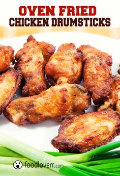 chicken wings and celery on a white plate