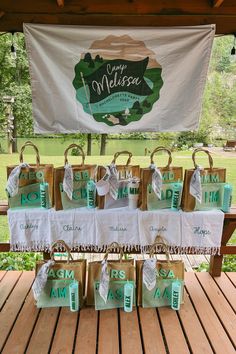 some bags are sitting on a table with the words happy melrose written on them