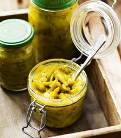 jars filled with pasta and pestles on a wooden tray