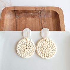 These lightweight rattan earrings are a great addition to your jewelry box. With their neutral resort wear style, these earrings can match anything! They feature a modern, clean design that can be worn every day or with a dressy outfit, and they're light enough to forget you're wearing them as you move around your day. They can go from beachside cocktail to dinner date in a snap, making it the perfect accessory for travel. Hypoallergenic stainless steel posts Durable plant-based acrylic posts Ha Chic Woven Earrings For Vacation, Trendy Vacation Earrings, Chic Drop Earrings For Beach, Chic Woven Jewelry For Vacation, Chic Beach Drop Earrings, Chic Woven Summer Jewelry, Chic Summer Woven Jewelry, Woven Natural Jewelry For Vacation, Natural Woven Jewelry For Vacation