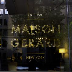 the front window of a new york city store that sells mason gerard's