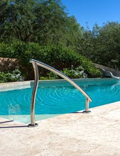 an empty swimming pool with a slide in the middle