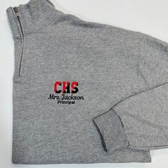 This sweatshirt lets you customize it with your school's initials in two thread colors, and a name below with an additional line of optional text underneath for a title school name, mascot name, etc. The optional line of text with be done in our basic block font due to size constraints. Product Details Adult Unisex Sizes Size Chart In Photos Pre Shrunk 50% Cotton 50% Polyester Pill resistant fleece, ribbed collar, cuffs, and waistband with spandex VIDEO: Katie is wearing a size small in the video and is 5'8, 155lbs for reference. Display Photo Display Photo: Oxford Grey Sweatshirt, Red & Black School Initial Thread, Black Name/Text Thread, Script Name Font Half-zip Sweatshirt For College, Charleston Wv, Block Font, Thread Colors, Photo Display, School Colors, Grey Sweatshirt, Pullover Sweatshirt, Quarter Zip