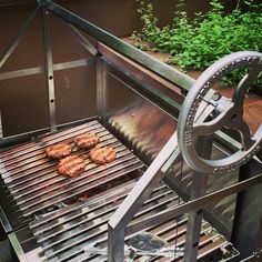 some food is cooking on a grill outside