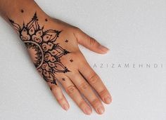 a person's hand with a tattoo on it