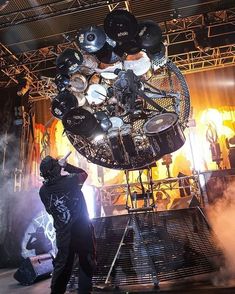 a man standing in front of a large metal object