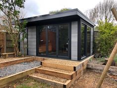 a garden room with steps leading up to it