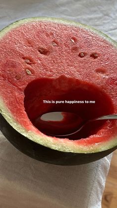 a piece of watermelon with a spoon in it