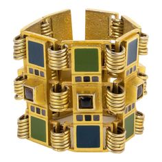 This is part of Chairish’s Costume Jewelry assortment.  This impressive Jean Paul Gaultier Paris oversized link bracelet features a heavy gilded metal geometric framing topped with kaki green and navy blue enamel sections and embellished with navy blue and mouse gray enamel cabochons. The bracelet closes with a box-closing clasp, and each element is engraved "JPG" underside. Measurements: The bracelet's total length is 7.50 in (19 cm) - width is 2.32 in wide (5.8 cm) - It will fit an average Med Jean Paul Gaultier Jewelry, Paul Gaultier, Contemporary Jewelry, Cuff Bangles, Jewelry Patterns, Jean Paul Gaultier, Jean Paul, Link Bracelets, Chain Bracelet