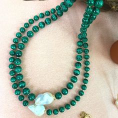 Introducing our stunning Malachite with Baroque Double Strands Necklace—a captivating piece that combines the beauty of malachite with the elegance of baroque pearls. The rich green tones of the malachite beads beautifully contrast with the organic shapes and iridescent luster of the baroque pearls. Handcrafted with meticulous attention to detail, this necklace adds a touch of sophistication to any outfit. Elevate your style with the mesmerizing charm of this exquisite accessory. It's elegant an Elegant Green Pearl Necklace With Natural Stones, Luxury Green Malachite Necklace, Elegant Single Strand Malachite Jewelry, Elegant Malachite Necklace With Natural Stones, Elegant Malachite Gemstone Beads Jewelry, Elegant Green Malachite Necklace, Elegant Green Baroque Pearl Necklace, Malachite Necklace, September Birthstone Jewelry