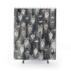 a shower curtain with many cats on it's sides and one cat in the middle