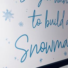 there is a sign that says snowman to build a snowman on the wall