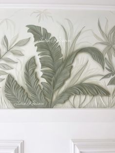 a painting on the wall with leaves painted on it