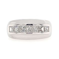 a white gold ring with princess cut diamonds