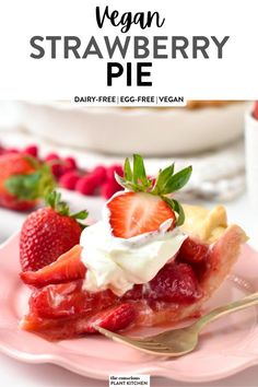 a strawberry pie on a pink plate with whipped cream and strawberries in the background