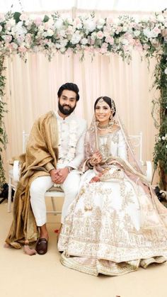 the bride and groom are posing for a photo