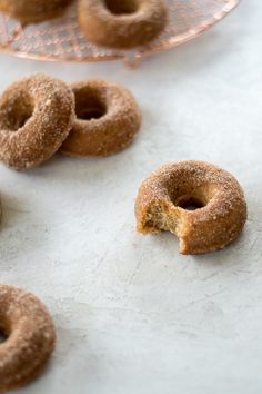 several donuts on a plate with one missing