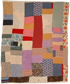 a multicolored patchwork quilt on display