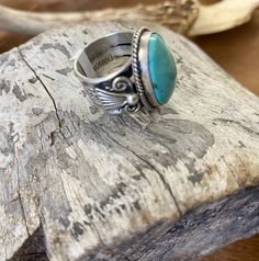 Be bold and unique with this absolutely stunning sterling silver statement Turquoise Oval Ring. Featuring a large beautiful turquoise oval stone set in a thick band, this size 6.5 ring will be sure to make a statement. Show off your style and sparkle with this one-of-a-kind accessory! This beautiful sterling silver unique turquoise ring was made by the talented Native American artist silversmith Donovan Cadman. The ring is stamped and signed by the artist inside of the ring band. This ring is su Western Style Ring With Large Stone For Gift, Western Style Gemstone Ring Jewelry, Western Style Gemstone Ring, Western Style Gemstone Ring Gift, Western Style Gemstone Ring As Gift, Western Style Gemstone Rings For Gifts, Bohemian Turquoise Sterling Silver Ring With Polished Finish, Western Style Turquoise Gemstone Rings, Turquoise Oval Cabochon Ring With Large Stone