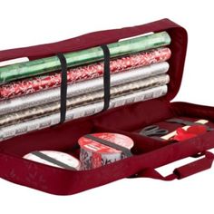 an open red case filled with different types of sewing supplies in it's compartments