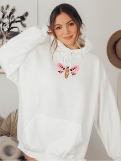 Embrace your free spirit with the 'Stay Wild Moon Child Butterfly Hoodie – a whimsical and cozy choice that reflects your adventurous soul. Make a statement with this hoodie that captures the essence of carefree and bohemian style. 🌙🦋 #StayWildMoonChildHoodie #BohemianFashion #FashionStatement #WhimsicalStyle #AdventureWear #FreeSpiritChic #ButterflyFashion #CozyChic #BohoStyle #FreeSpiritFashion #AdventureReady #StatementHoodie Butterfly Hoodie, Trendy Vest, Butterfly White, Butterfly Fashion, Stay Wild Moon Child, Wild Moon, Orange Jacket, Free Spirit Style, Western Jacket