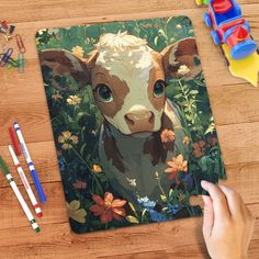 a mouse pad with a painting of a brown and white cow surrounded by colorful flowers